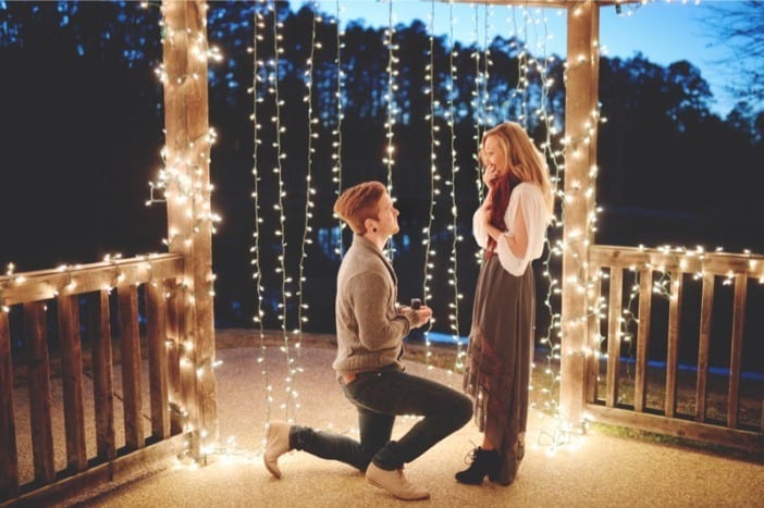 A man proposes to his wife at a romantic B&B.