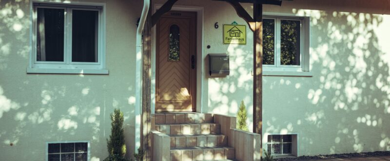 The entrance of an Airbnb property that uses a smart lock system for entry